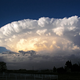 Supercell storms are distinguishable from other thunderstorms by their large-scale rotation.